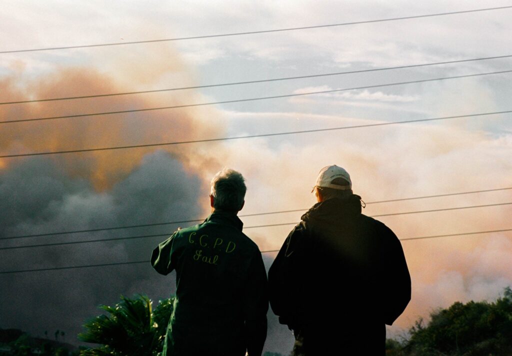 Homeowners assess wildfire damage while facing insurance company bad faith after a wildfire in Northridge, CA.