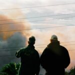 Homeowners assess wildfire damage while facing insurance company bad faith after a wildfire in Northridge, CA.