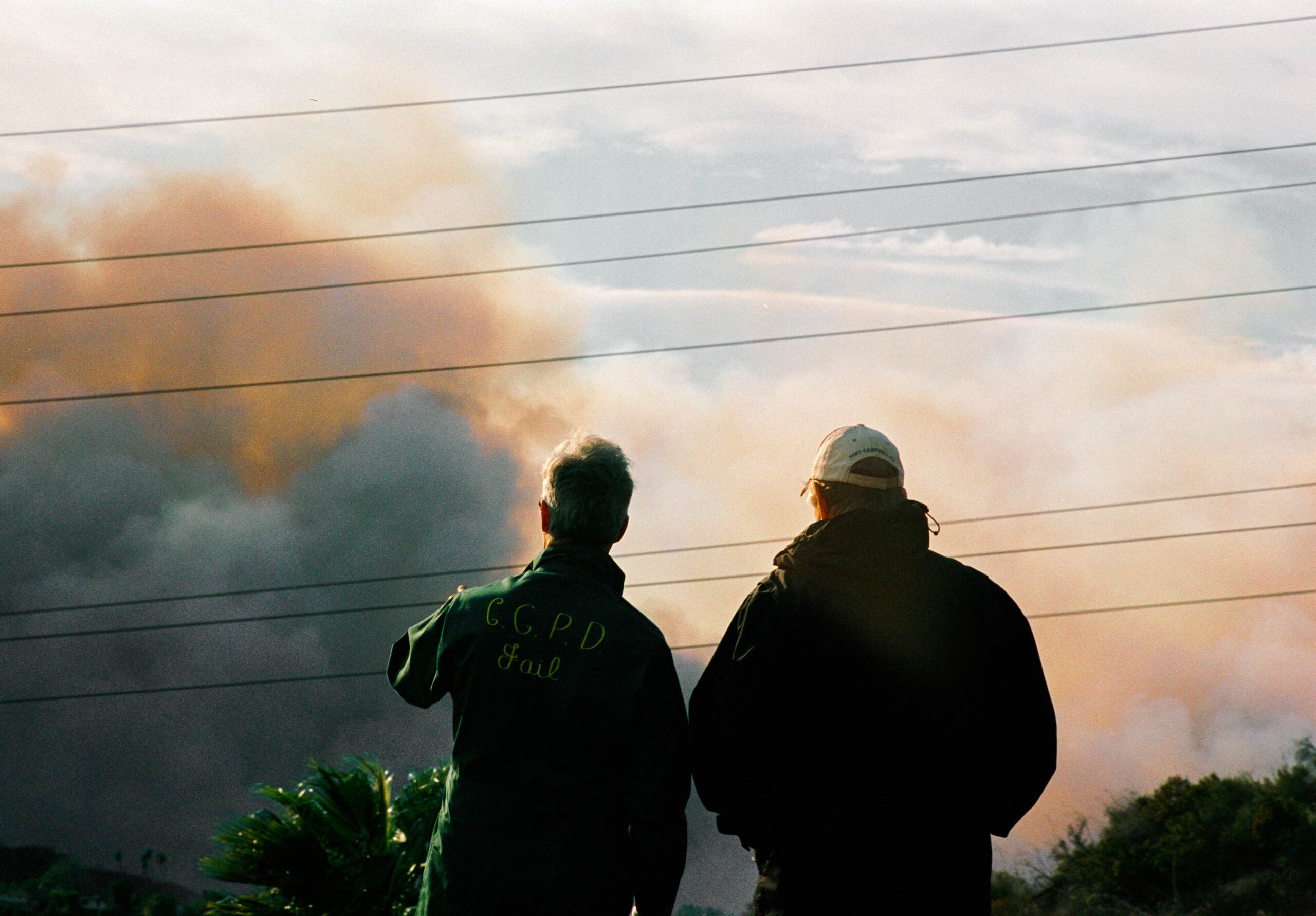Homeowners assess wildfire damage while facing insurance company bad faith after a wildfire in Northridge, CA.