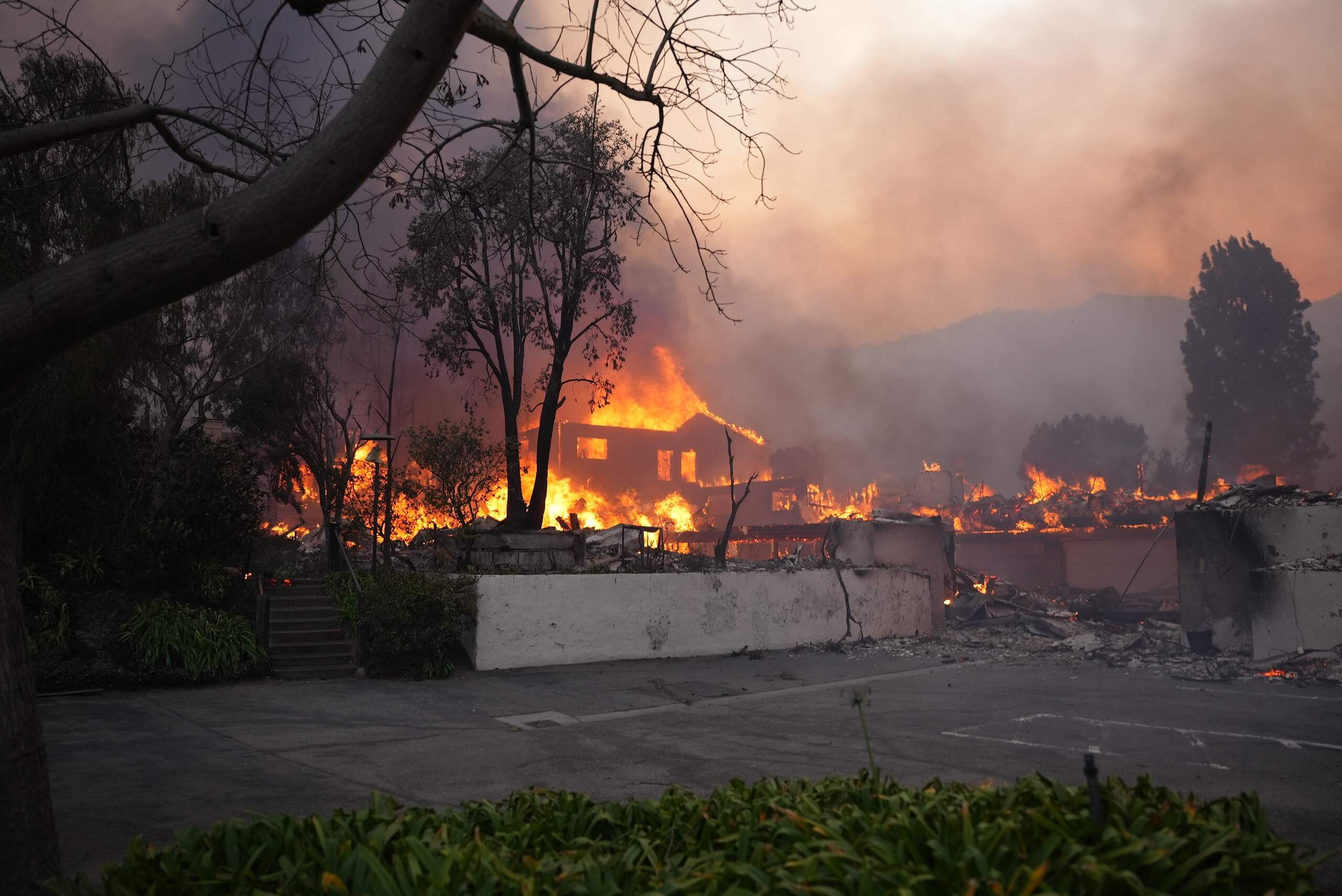 Residential properties destroyed by a California wildfire, highlighting the importance of legal help when asking, “Do I need a lawyer for a wildfire insurance claim?”