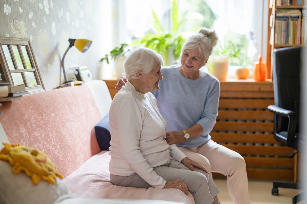 A daughter acting as caregiver to mother in her home