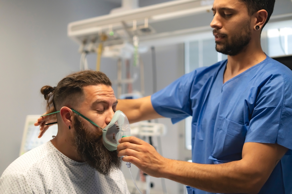 Man receives breathing treatment to support post-covid syndrome