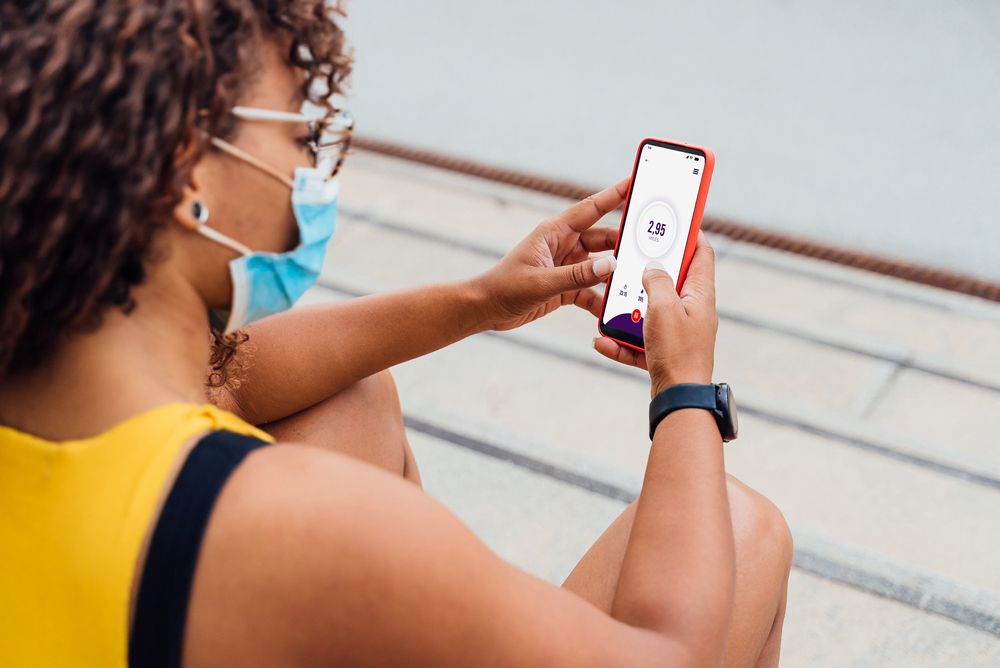 Woman posting on social media in public