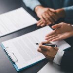 Client reviews a contract with a lawyer