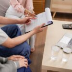 Legal advisor reviews insurance contract with client